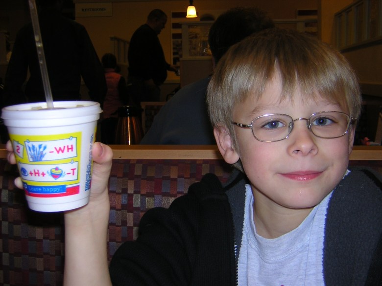 Can you tell where we had breakfast? Look for the clue on Brandon's cup. The first person to figure it out and enter your answer in the comments below wins a prize!
