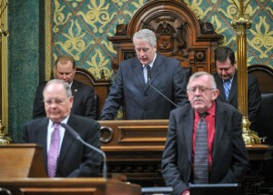 At the Speaker's rostrum offering the invocation